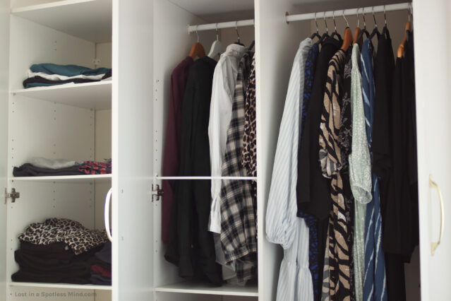 The inside of a closet, with garments in mostly black and white and animal print (yes, it's a neutral).